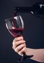 Red wine pouring glass Royalty Free Stock Photo