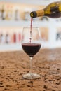 Red Wine pouring in a glass and Bottle Royalty Free Stock Photo