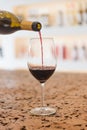 Red Wine pouring in a glass and Bottle Royalty Free Stock Photo