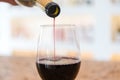 Red Wine pouring in a glass and Bottle Royalty Free Stock Photo