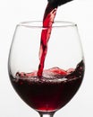 red wine pouring into glass