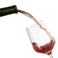 Red wine pouring into glass with splash isolated on white Royalty Free Stock Photo