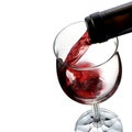 Red wine pouring into wine glass