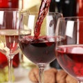 Red wine pouring into a wine glass Royalty Free Stock Photo