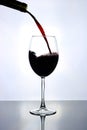 red wine pouring into wine glass