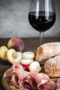 Red wine with prosciutto and ciabatta Royalty Free Stock Photo