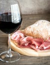 Red wine with prosciutto and ciabatta Royalty Free Stock Photo