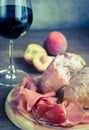 Red wine with prosciutto and ciabatta Royalty Free Stock Photo