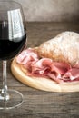 Red wine with prosciutto and ciabatta Royalty Free Stock Photo