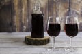 Red wine rustic bottle and two red wine glasses Royalty Free Stock Photo