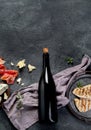 Red wine Sirah with appetizers on gray background Royalty Free Stock Photo