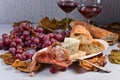 Red wine with snack and grapes . Royalty Free Stock Photo