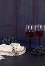 Red wine and snacks. Wine, grapes, cheese, nuts, olives. Romantic evening, still life. Royalty Free Stock Photo