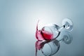 Red wine spilled out of a falling glass Royalty Free Stock Photo