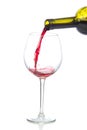 Red wine splash being poured into a wine glass Royalty Free Stock Photo