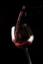 Red wine splash on a glass Royalty Free Stock Photo