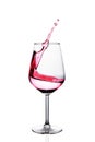 Red wine splash in glass isolated over white Royalty Free Stock Photo