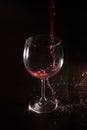 Red wine splash in motion on black background