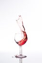 Red wine splash over white background Royalty Free Stock Photo