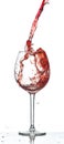 Red wine splash over white background Royalty Free Stock Photo