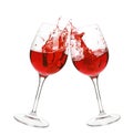 Red wine splash in two glasses Royalty Free Stock Photo