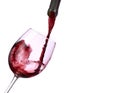 Red wine splashing from bottle to glass Royalty Free Stock Photo