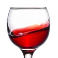 Red wine splashing in a glass closeup Royalty Free Stock Photo