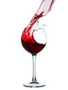 Red wine splashing in a glass Royalty Free Stock Photo
