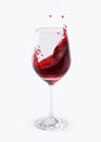 Red Wine Splashing In Glasses isolated on white with clipping path. Royalty Free Stock Photo