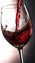 red wine splashing out of a glass, isolated on black background. Royalty Free Stock Photo