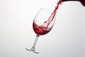 Red wine splashing out of a glass, isolated on white background - Ai Generated Royalty Free Stock Photo