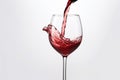 Red wine splashing out of a glass, isolated on white background - Ai Generated Royalty Free Stock Photo