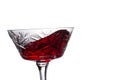 Red wine splashing in a vintage glass Royalty Free Stock Photo