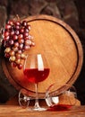 Red wine.Still life with two glasses of red wine, grapes and barrel.Selective focus.Copy space Royalty Free Stock Photo