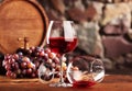 Red wine.Still life with two glasses of red wine, grapes and barrel.Selective focus.Copy space Royalty Free Stock Photo