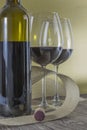 Red wine theme _ single wine bottle and two glasses Royalty Free Stock Photo