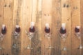 Red wine in transparent wine glasses on a wooden background. Bojole nouveau, wine bar, winery, winemaking, wine tasting concept, Royalty Free Stock Photo