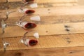 Red wine in transparent wine glasses on a wooden background. Bojole nouveau, wine bar, winery, winemaking, wine tasting concept, Royalty Free Stock Photo