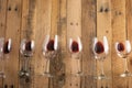 Red wine in transparent wine glasses on a wooden background. Bojole nouveau, wine bar, winery, winemaking, wine tasting concept, Royalty Free Stock Photo