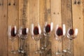 Red wine in transparent wine glasses on a wooden background. Bojole nouveau, wine bar, winery, winemaking, wine tasting concept, Royalty Free Stock Photo