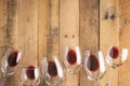 Red wine in transparent wine glasses on a wooden background. Bojole nouveau, wine bar, winery, winemaking, wine tasting concept, Royalty Free Stock Photo