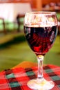 Red wine in wineglass on the table with a tablecloth in a restaurant. loneliness. Royalty Free Stock Photo