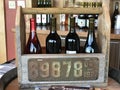 Red wines on display in wooden carrier at Marks Ridge Winery