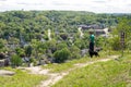 Red Wing, Minnesota - May 25, 2019: Hiker man walking his dog ventures off on an unapproved trail, despite the warning signs of