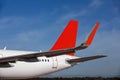 Red wing and tail detail from parked aircraft Royalty Free Stock Photo