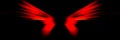 Red wings of demon on black background. Royalty Free Stock Photo