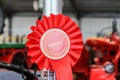 A red first winner rosette