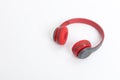 Red wireless headphone on white background. Royalty Free Stock Photo