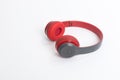 Red wireless headphone on white background. Royalty Free Stock Photo