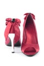 Red women high heel shoes closeup over white